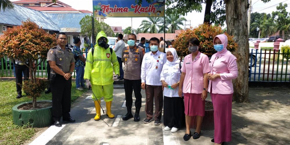 Polres Kampar Kerjasama dengan Dinkes Kampar, Cegah Penyebaran Covid -19 di Area Layanan Publik