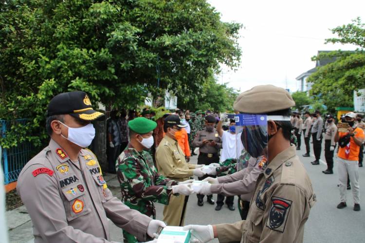 Bupati Inhil Pimpin Apel Gelar Pasukan Tim Terpadu Penegak Disiplin Covid 19.