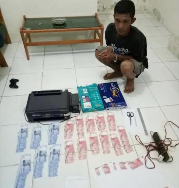 Palsukan uang 23 juta warga simpangl karet km 14 kulim,Desa boncah mahang,mandau Bengkalis,di aman kan polisi