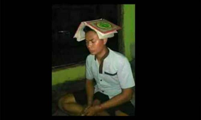 Beredar Foto Pemuda Injak Alquran di Medsos
